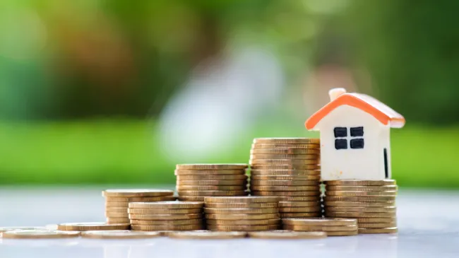 house on stack of coins